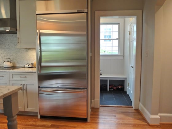 area of old kitchen converted to mud room with half bath