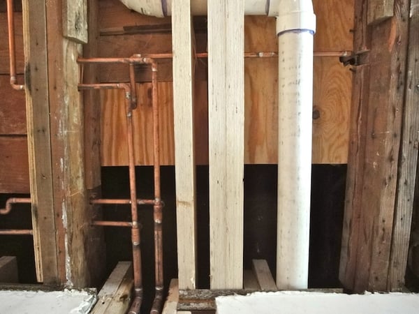 corrected framing and plumbing under bathroom floor