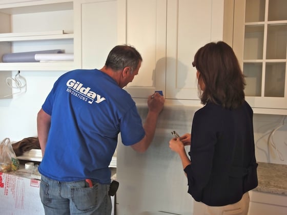 Mike marks placement for cabinet hardware