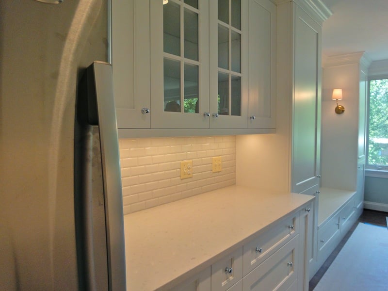 tiny condo kitchen is open to dining area