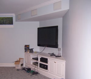 basement media center with built-in wall speakers